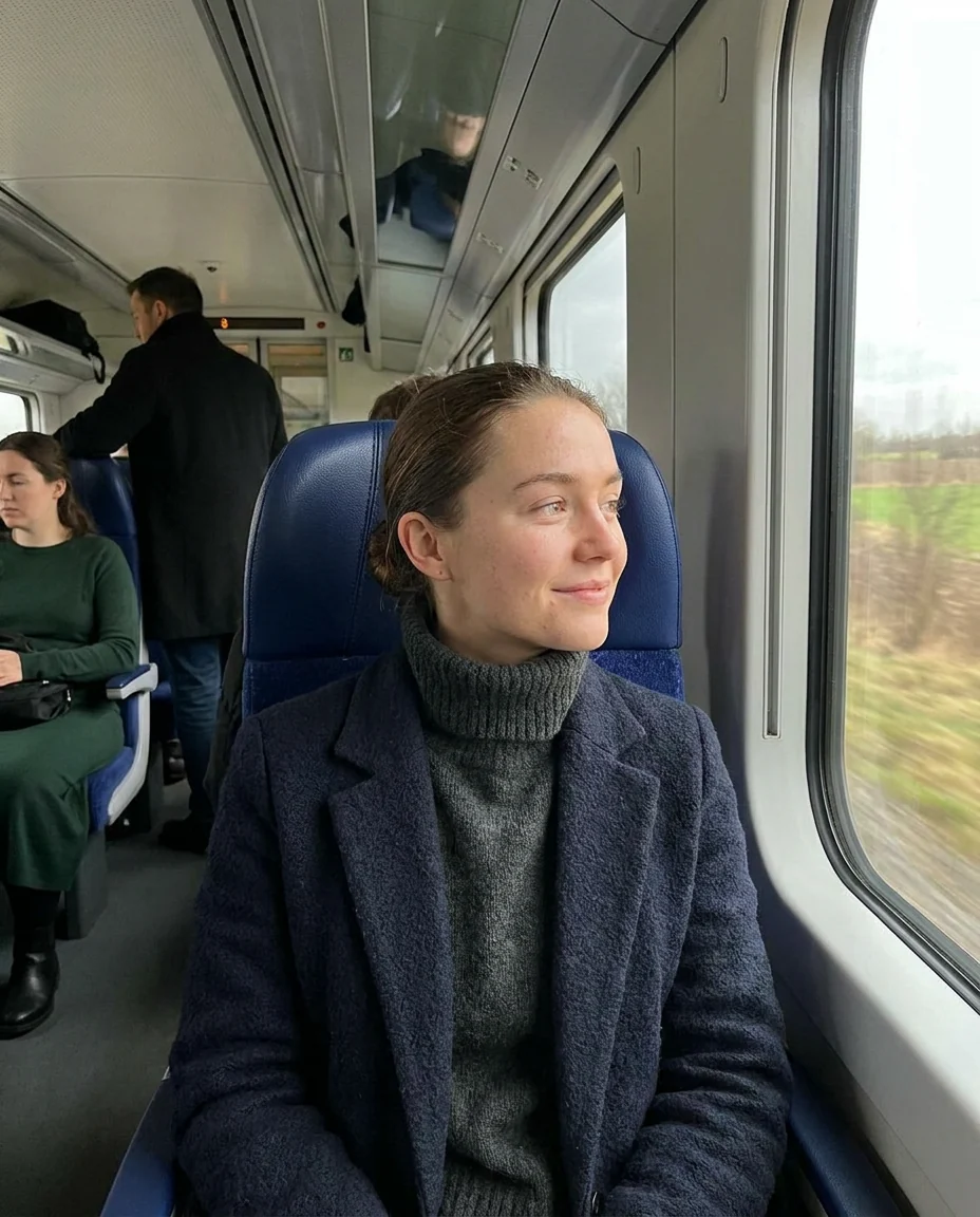 Example story: a woman on a train looking out of the window
